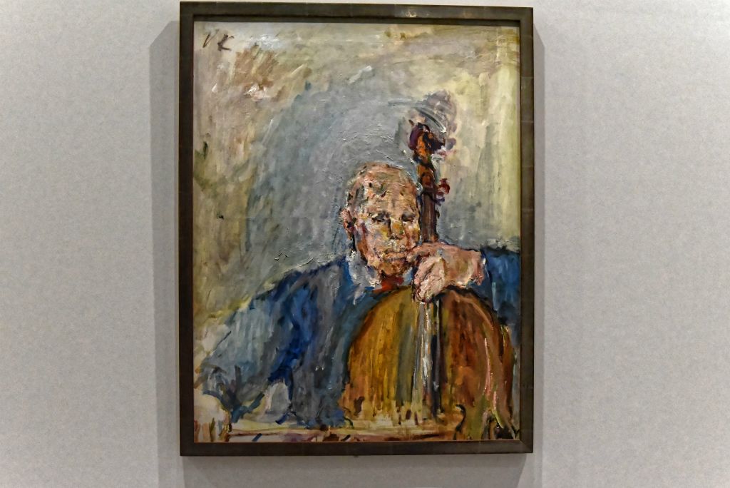 Le musicien est représenté sur son instrument entouré d'une aura bleue.